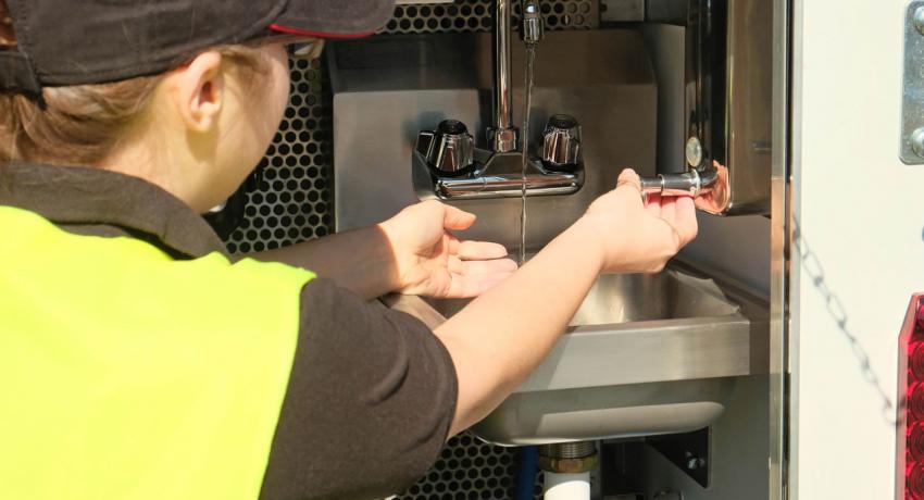 Stainless sink, waste reservoir and soap dispenser